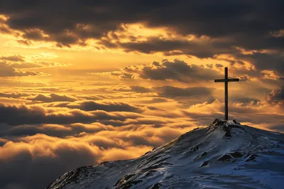 Easter Cross Sunrise Over Snowy Mountain Ridge