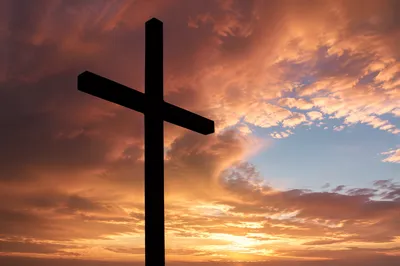 Easter Cross Silhouette at Dramatic Sunrise