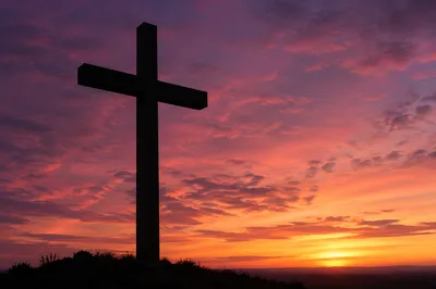 Easter Cross Silhouette at Dramatic Sunrise