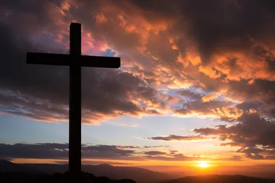 Easter Cross Silhouette at Dramatic Sunrise