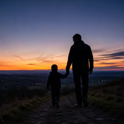 Father and Child on Sunset Hillside Path