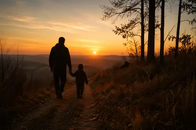 Father and Child Walking at Sunset