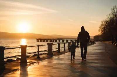 Father and Child Sunset Waterfront Walk