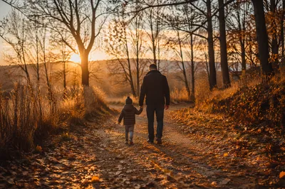 Father and Child on Autumn Sunset Path