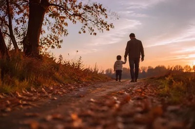Father and Child on Autumn Sunset Path
