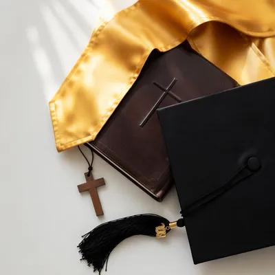 Graduation Cap Bible and Cross Flat Lay