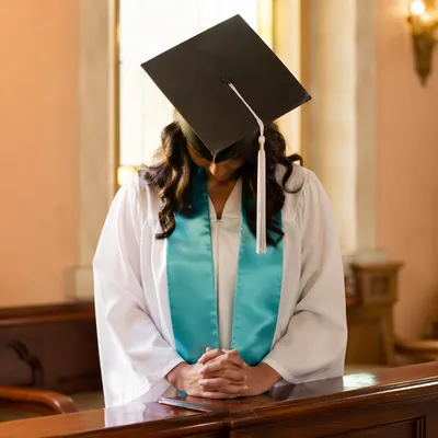 Graduate Prayer in Sunlit Chapel