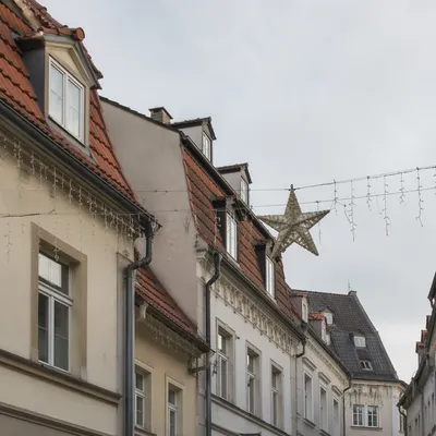 Christmas Lights Hanging on Townhouse Rooftops