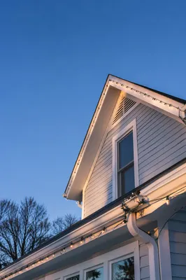 Christmas Lights Along Suburban Rooftop Gable
