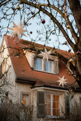 Christmas Lights Framing Cozy House Rooftop
