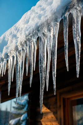Winter Icicles on Snowy Cabin Roof