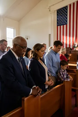 Congregation Praying in Church With Flag