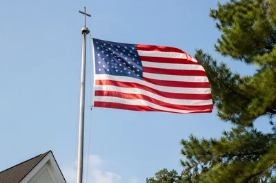 American Flag by Church Cross Flagpole