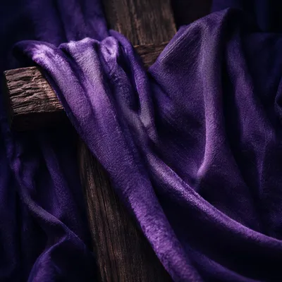 Purple Lenten Cloth Draped Over Wooden Cross