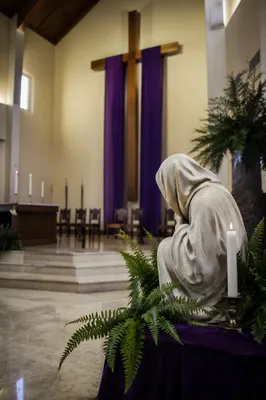 Purple Draped Lenten Cross in Quiet Sanctuary