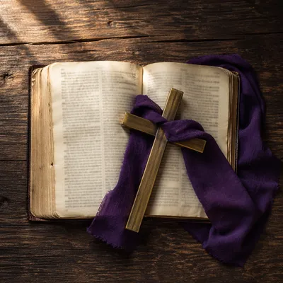 Open Devotional Book with Brass Cross