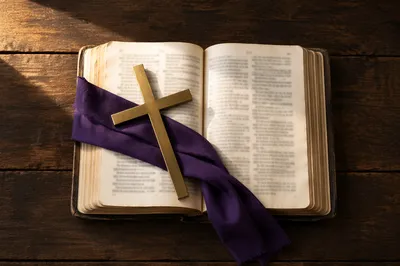 Open Devotional Book with Brass Cross