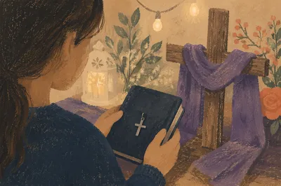 Hands Holding Devotional Book and Cross