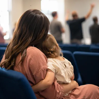 Mother Praying With Child in Soft Light