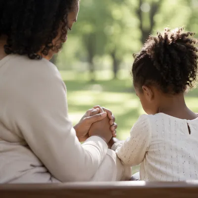 Mother and Child Prayer in Soft Light