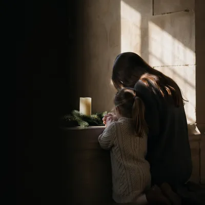 Mother and Child Praying in Chapel Light