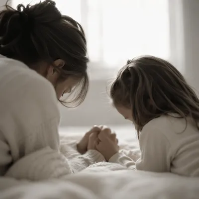 Mother and Child Praying in Winter Light