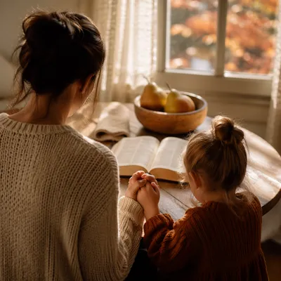 Mother and Child Praying in Autumn Light