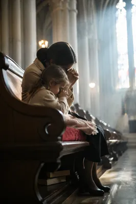 Mother and Child Praying in Winter Light