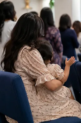 Mother and Child Praying in Spring Fellowship