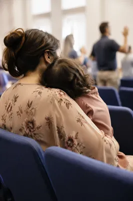Mother and Child Praying in Soft Light