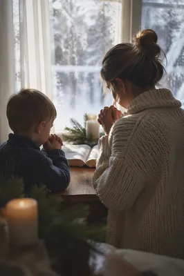 Mother and Child Praying by Frosted Window