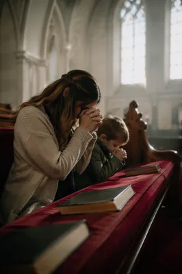 Mother and Child Praying in Winter Light