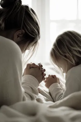 Mother and Child Praying in Winter Light