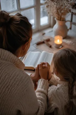 Mother and Child Praying on Winter Morning