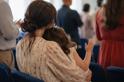 Mother and Child Praying in Soft Spring Light