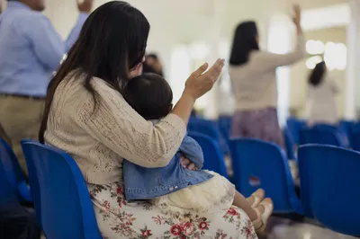 Mother and Child Praying in Spring Gathering