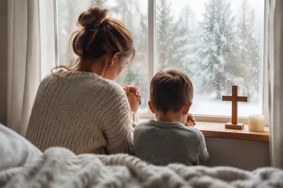 Mother and Child Praying by Frosted Window