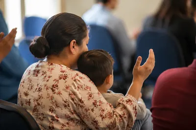 Mother Praying with Child in Soft Light