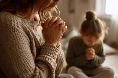 Mother and Child Praying in Soft Light