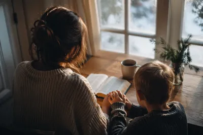 Mother and Child Praying on Winter Morning