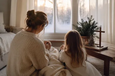 Mother and Child Praying in Winter Light