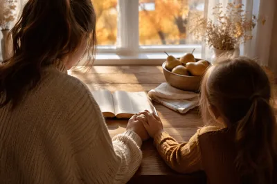 Mother and Child Praying in Autumn Light