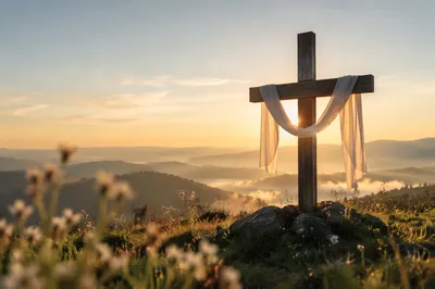 Resurrection Cross with White Cloth at Sunrise