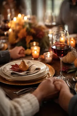 Thanksgiving Family Prayer at Candlelit Dinner Table