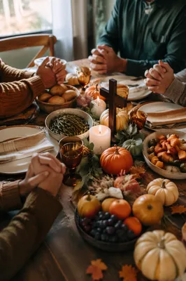 Thanksgiving Family Prayer Around Rustic Table