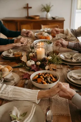 Thanksgiving Family Prayer Around Rustic Dinner Table