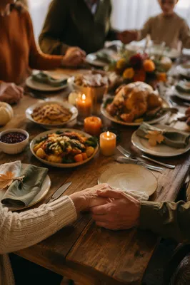 Thanksgiving Family Prayer Around Rustic Dinner Table