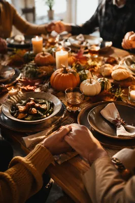 Thanksgiving Family Prayer Around Rustic Table