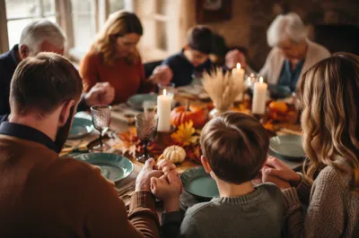 Thanksgiving Family Prayer Around Rustic Dinner Table