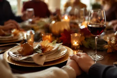 Thanksgiving Family Prayer at Candlelit Table
